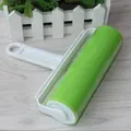 Professional handheld reusable lint roller featuring a green adhesive roll and ergonomic white handle - Large Lint Roller / Green