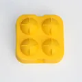 Yellow 4-hole spherical ice cube tray mold with easy-release design for homemade cocktails - 4 Hole Ice Ball Mold / Yellow