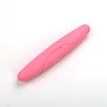 Portable candy pink toothbrush storage case for travel with secure lid and sealed design - Pink