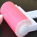 Close-up of a portable washable pink lint roller for hair and dust removal. - Medium Roller With Lid / 10*10*5.5cm / Pink