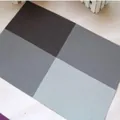 Modern PVC heat-resistant placemat with four-color grid design in dark grey and brown - Coffee
