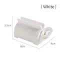 Manual white toothpaste squeezer and facial cleanser dispenser with rolling key - White