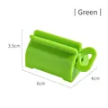 Manual toothpaste squeezer dispenser in bright green finish showing 6cm x 4cm size - Green