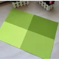 Green checkered PVC placemat with heat-resistant design for modern dining table protection - Green