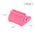 Pink manual rolling toothpaste squeezer dispenser for bathroom storage accessories - Pink