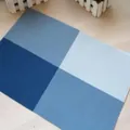Modern blue grid PVC heat-resistant placemat for stylish table protection and decoration. - Blue