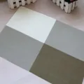 Heat-resistant PVC dining placemat with four-color grid pattern in neutral tones - Khaki