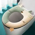 Warm plush toilet seat cover with cute cat ears and paw design in green and beige - Green + White