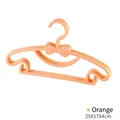 Set of orange plastic adult clothes hangers featuring a cute bow-tie design for drying - 5 Pieces / Orange