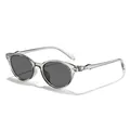 Fashionable cat-eye sunglasses featuring transparent grey frames and dark tinted lenses. - Translucent Grey Frame Grey Lens
