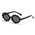 Adorable black flower-shaped sunglasses for children featuring UV400 sun protection - Black Frame Grey Lens