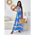 Elegant blue and white floral print halter maxi dress for summer beach vacations - S / Dresses / Sky Blue