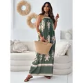 Bohemian green halter maxi dress with floral print and loose fit for summer look. - S / Dresses / Green