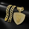 Detailed macro view of iced out gold Cuban chain with lion head KING shield pendant - Gold Pendant with Cuban Chain / 18 inch
