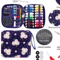 Portable sewing kit with multi-color threads and tools in purple daisy waterproof case. - Purple Daisy