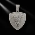 Detailed view of hip hop style iced out shield pendant with lion head and KING text - Silver Pendant Only