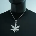 Detailed view of hip-hop iced-out maple leaf pendant necklace with glistening rhinestones - Necklace Set / Silver