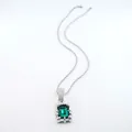 Close-up of elegant silver necklace featuring a rectangular green emerald gemstone pendant - Rope Chain Necklace / 20 inch / Silver Green