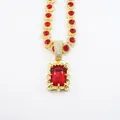 Luxurious retro iced out hip hop necklace with large red ruby pendant in gold finish - Curb Chain / 20 inch / Gold Red