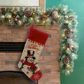 Festive burlap Christmas stocking with snowman design hanging on fireplace mantle. - Snowman Style / 46*25CM