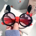 Cute cartoon rabbit shaped sunglasses for kids with red bow and UV protection lenses - Black Frame Red Temples Gradient Grey