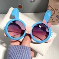 Cute blue rabbit sunglasses for kids with round gradient lenses and pink bow detail. - Blue Frame Pink Leg Gradient Gray Lens