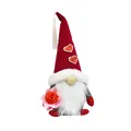 Detail of a festive gnome doll holding a rose with sequin heart accents on hat. - Bouquet Style