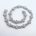 Detailed view of luxury silver iced-out four-leaf clover and infinity link Cuban chain - 18inch(45cm) / Silver