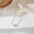 Detailed view of a sparkling round-cut zircon set in an elegant six-prong gold-tone pendant. - Gold (N144 White)