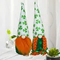 Pair of festive St. Patrick's Day gnomes featuring shamrock hats and orange braids - Set