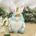 Easter bunny gnome plush doll with blue fuzzy hat and carrot decoration on burlap - Blue