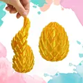 Yellow 3D printed dragon egg fidget toy with rotating deformable spiral structure - Dragon Egg Shuttle Ball / 4.6x5.6cm (26g) / Gold