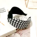 Close-up of a French vintage houndstooth knotted headband on a fashion magazine background - Houndstooth Cross Knot / Black