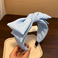 Elegante cerchietto in raso azzurro con fiocco e motivo a stelle scintillanti - Azzurro