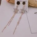 Pendientes largos de acero inoxidable oro rosa con estrellas y pernos negros chic - Borla de Estrella Redonda (8557)