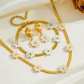 Detail view of titanium steel gold jewelry set with white shell-like daisy flowers - Chrysanthemum Set 02 (B104-N302-A803) / Gold