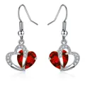 Detailed close-up of heart-shaped drop earrings with red faceted stones and plating - Hook Style / Red