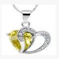Heart-shaped necklace featuring a large yellow crystal pendant with silver wave chain - Yellow
