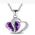 Elegant silver heart necklace featuring a vibrant purple crystal pendant on water wave chain - Purple