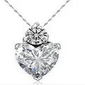 Elegant silver-tone necklace with heart-shaped crystal pendant on water wave chain - White