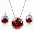 Detailed view of the elegant round red zircon necklace and matching stud earrings set - Red