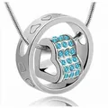 Elegant silver-tone rotating heart pendant necklace featuring sparkling light blue crystals - Sea Blue Stone Style / K9 / Silver