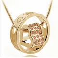 Elegant heart rotating pendant necklace with sparkling pink crystals in a polished gold finish - Pink Zircon Style / K9 / Gold