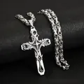 Close-up view of vintage silver stainless steel cross pendant with detailed engraving - Steel Color (Byzantine Chain)