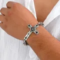Macro view of vintage stainless steel cross bracelet with black enamel on male wrist - Steel Color Cross Bracelet