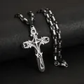 Detailed macro view of an ornate silver cross pendant with a bicolor Byzantine chain - Black and Steel Color (Byzantine Chain)