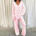 Soft pink fuzzy loungewear set featuring a V-neck sweater and flared knit pants. - S / Top And Bottom / Pink
