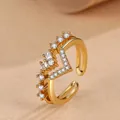 Detail view of a V-shaped double-layered gold ring with heart-shaped cubic zirconia. - Adjustable Open / Gold