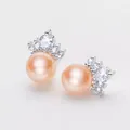 Elegant close-up view of 8mm pink freshwater pearl stud earrings with crown zircon settings - Crown Style / 8mm Pearl / Pink Pearl