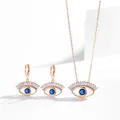 Elegant rose gold evil eye jewelry set featuring blue stone necklace and earrings set - Necklace and Earring Set / Rose Gold